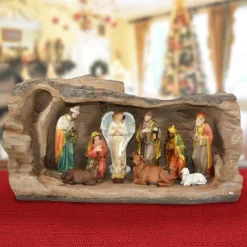 NATIVITA' IN RESINA SCENARIO TRONCO ALBERO CON LUCE CALDA DECORAZIONI NATALIZIE